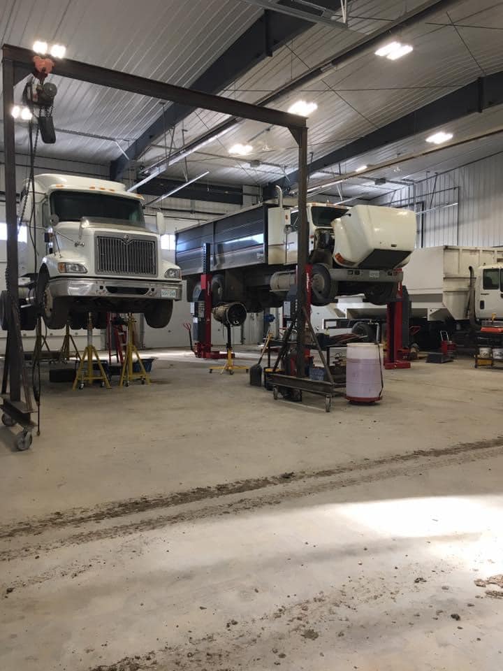 trucks on hoist Heavy Trucks and Trailers services
